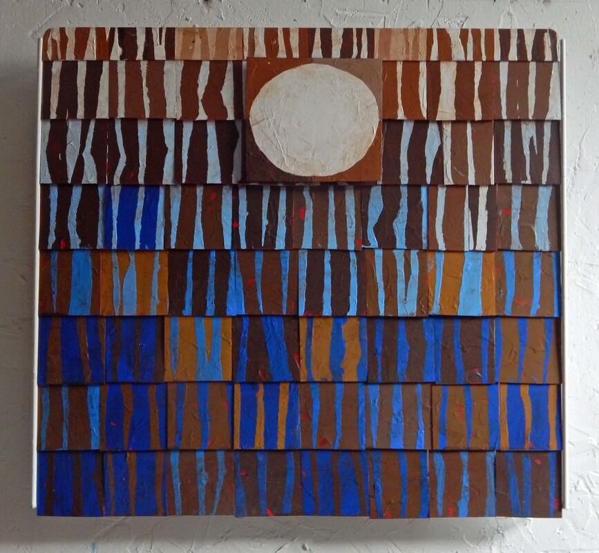 An abstract image painted on tiles in short stripes of various shades of brown and blue with a large tile displaying an abstract image of the moon near the top just to the right of center.