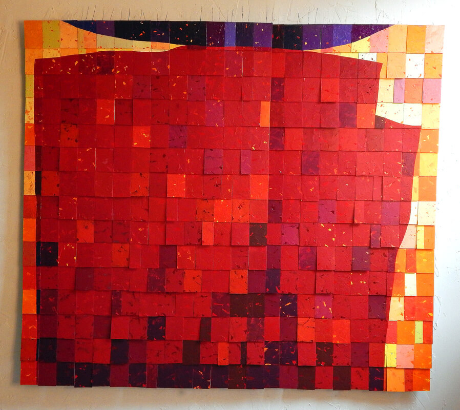 An abstract image painted on tiles of a red wall/