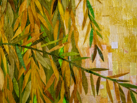 A close up view of a section of Wading Through The Willows is a 36&quot; x 36&quot; mixed media piece of  painted paper collage on canvas. It pictures a young woman with dark hair, wearing a yellow dress, surrounded by a drape of willow branches against a blue sky, surrounded by a thick drape of golden yellow and green willow branches against a blue sky.