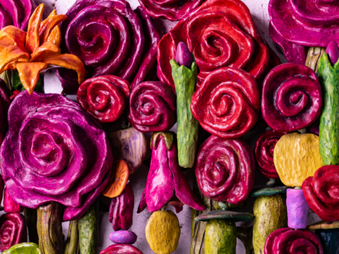 Close-up of vibrant, abstract roses and other flowers in red, pink, and orange hues from the mixed media artwork &quot;Bouquet For Grace&quot; by Oklahoma artist Paul Medina.