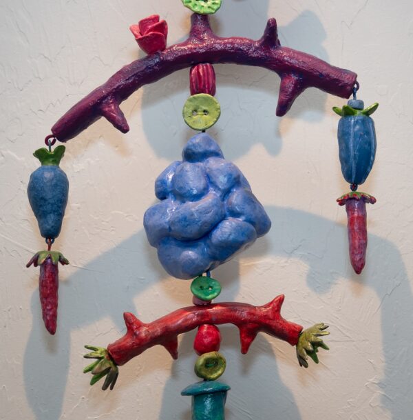 I Give You My Heart is a 12" x 54" x 8"mixed media on fired clay, steel, copper and nylon cord.