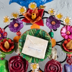 THINKING OF YOU (2025) is a 5&#039;x5&#039;x9&quot; wall amulet made of mixed media on low-fired clay, steel, copper and nylon cord.