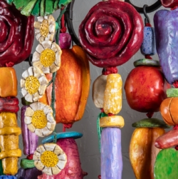 THINKING OF YOU (2025) is a 5&#039;x5&#039;x9&quot; wall amulet made of mixed media on low-fired clay, steel, copper and nylon cord.